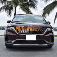 Kia Carnival 2.2D Signature 2023 màu đỏ mận