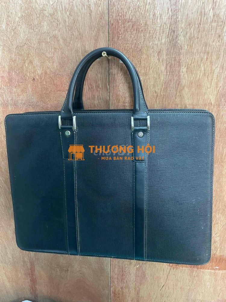 Túi sách Samsonite da bê dập vân.