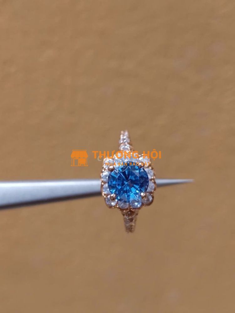 Bán nhẫn nữ vàng 18k đá topaz xanh 7ly1 tl 1chỉ