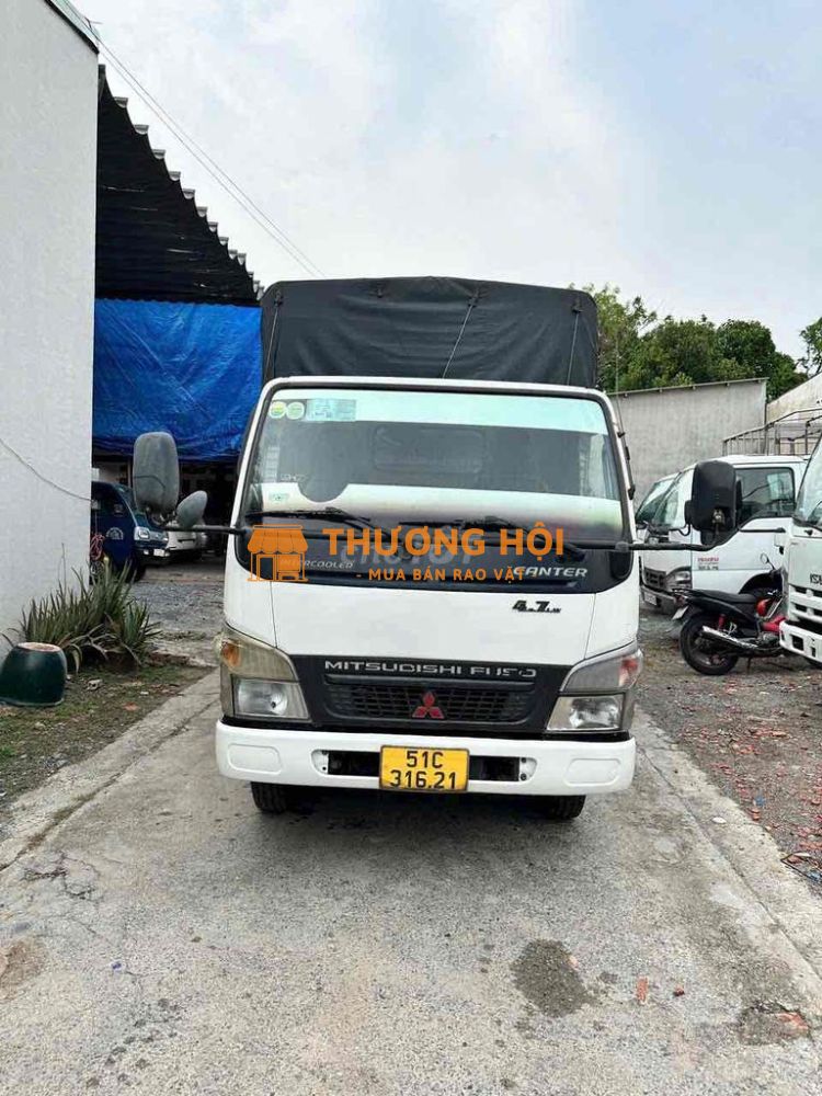 Gia đình cần bán mitsu sx 2013 tải 1t8 thùng dài 4